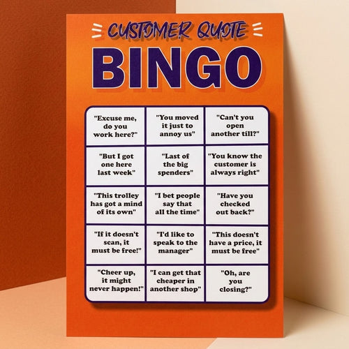 A customer quote bingo card game board with an orange background and a grid of white boxes containing humorous customer quotes, shown standing against a beige wall.