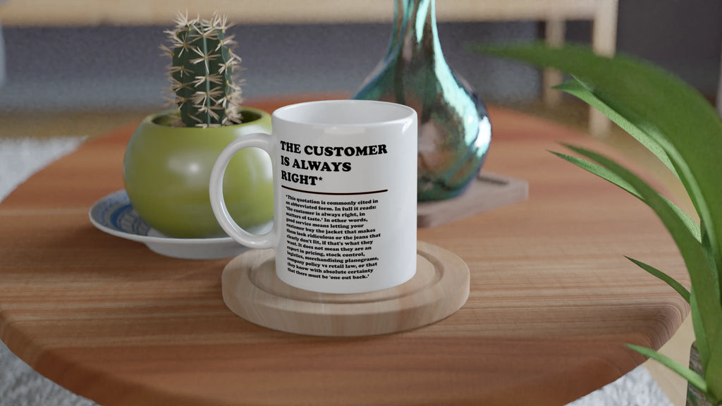 Lifestyle photo of a white mug on a kitchen table featuring the phrase "The Customer is Always Right*" with a humorous disclaimer explaining why the customer is not always right by Retailer Therapy