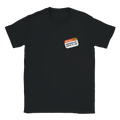 Front view of a black t-shirt with a printed imitation nametag saying 'Hi! I'm Moderately Here to Help' by Retailer Therapy